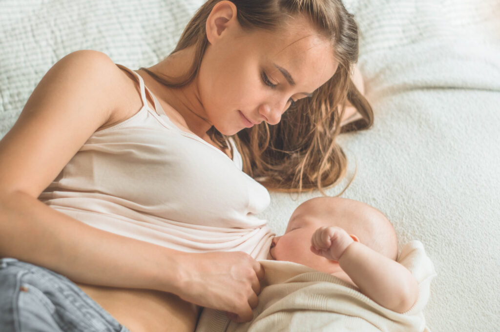 Portrait of a mom and breastfeeding baby.